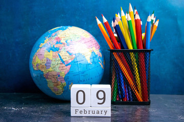 February 9 on the wooden calendar.The ninth day of the winter month, a calendar for the workplace....