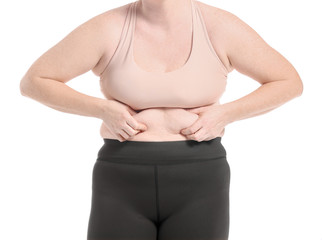 Fototapeta premium Woman with excess weight on white background