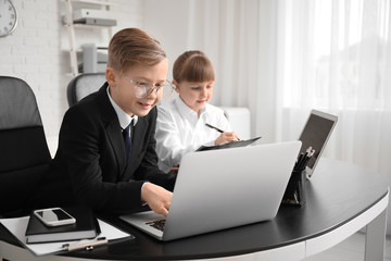Little secretaries working in office