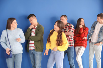 People waiting in line on color background