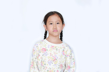 Funny face not satisfied of asian little child girl on white background.