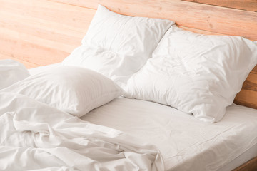 Fototapeta na wymiar Big comfortable bed with clean linen in room