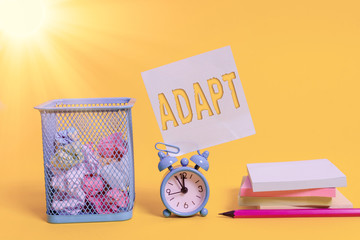 Writing note showing Adapt. Business concept for Make suitable for a new use or purpose Adjusted to...