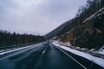 Snowfall on the road on the pass