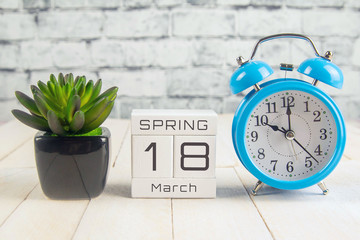 March 18 on the wooden calendar.The eighteenth day of the spring month, a calendar for the workplace. Spring