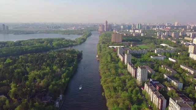 Aerial view in the area of Mitino, North and South Tushino, Pavshino, Silver Boron Park. Moscow River Canal, a view of the cityscape.