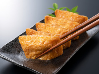 Inari Sushi on a black background
