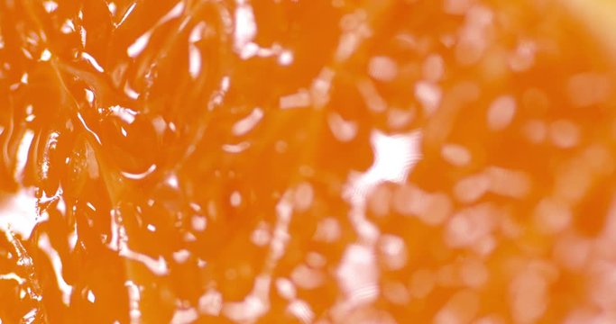 The flesh of a ripe tangerine rotates slowly.