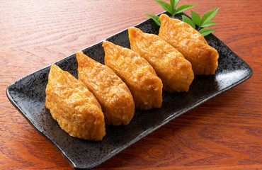 Inari Sushi set against a wooden background