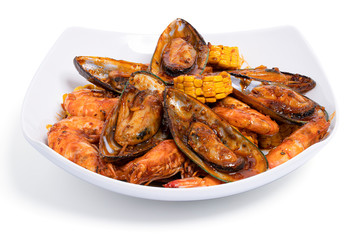 Spicy Shrimp and mixed seafood Thai Style isolated on white background with clipping path,  Koong Tung.