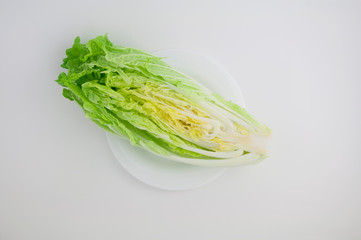 Chinese cabbage (in Japan called Hokusai) cut in poplam on a white isolated background close-up