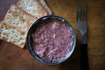 can of crumbled tuna with water biscuits
