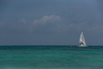 Xpu-ha, Quintana Roo, Mexico
little sailboat in a beautiful turquoise blue water Caribbean beach