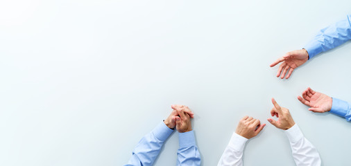 Top view of business meeting. Three men discussing at white table.