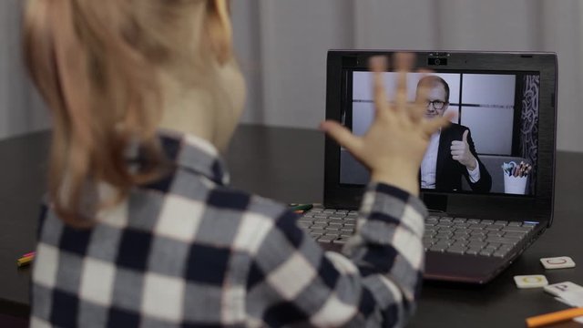 Children pupil distance education on laptop. Online lesson at home with teacher
