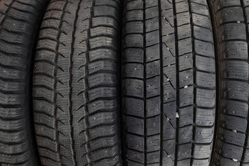 Tire stack background. Winter rubber vehicle tire
