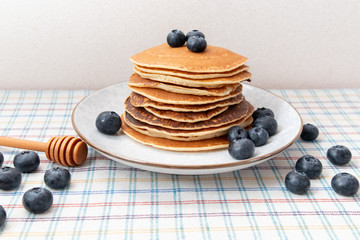 Stack of pancakes healthy breakfast with blueberries on plate in table. Stilllife Healthy breakfast