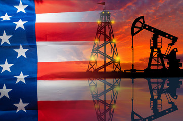 Oil production in the United States. Oil platform on the background of the American flag. American...