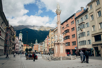 Innsbruck, Austria - 20th September 2015: Maria-Theresien-Strasse (Maria Theresa Street) with the Annasaule (St. Anna's Column), one of the busiest streets in the city of Innsbruck, Tyrol, Austria