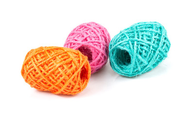 Colorful woolen balls over white background.