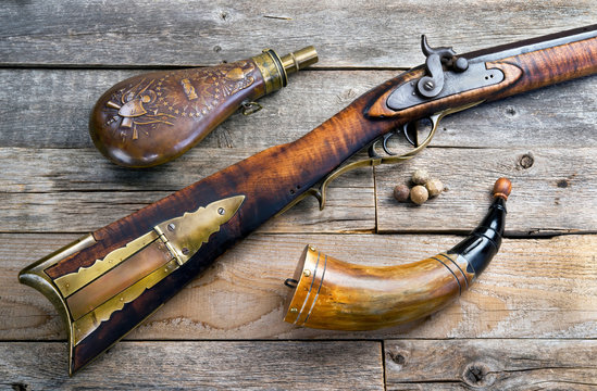 Antique Mountain Man Rifle and Powder flasks made in the 1840's.