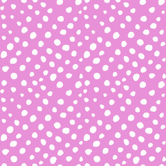 Pink and white hand drawn polka dot seamless pattern. Vector children pastel print for apparel, textile, fabric. EPS10