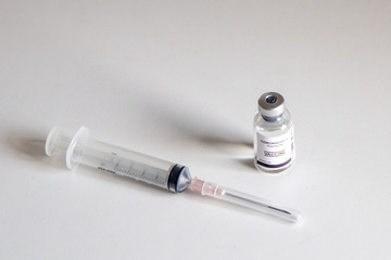 Vaccine and syringe injection on table. Use for prevention,immunization and treatment from corona virus infection novel coronavirus disease,COVID-19,nCoV 2019.