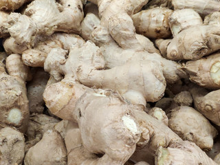 Fresh Ginger Roots on a counter in the market. Selective focus.