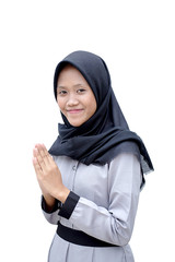 Portrait of young asian Muslim woman welcoming guests / Ramadan kareem, Ied Fitr Greeting isolated on white background