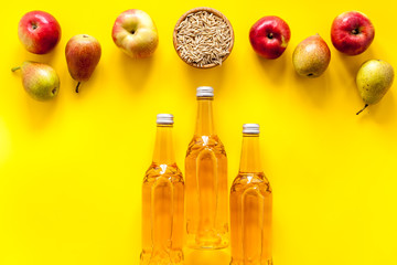 Set of beer bottles with apple, pears, wheat top-down