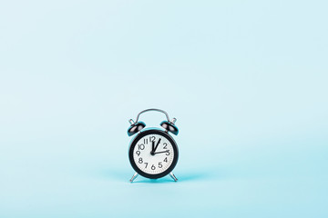 Retro alarm clock on blue background. Mockup, template. Time for work after and coronavirus...