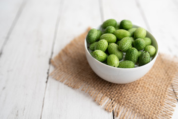 Freshly harvested cucamelons, Mexican sour gherkin pepquino or mouse melon. Sour grape size cucumbers. 