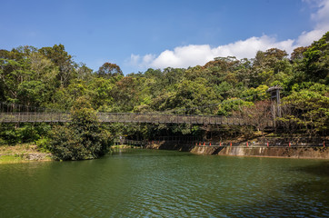 Fototapeta na wymiar pond with suspension bridge at Toushe Reservoi