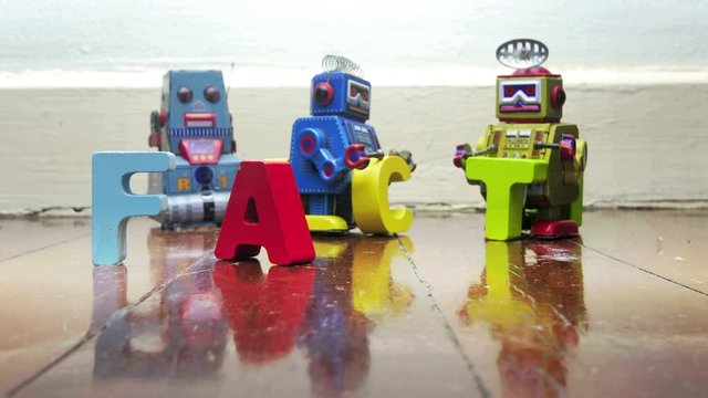 stop motion robots with wooden letters  FAKE /FACT  