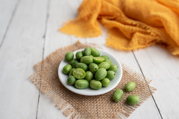 Freshly harvested cucamelons, Mexican sour gherkin pepquino or mouse melon. Sour grape size cucumbers. 