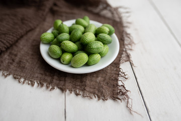 Freshly harvested cucamelons, Mexican sour gherkin pepquino or mouse melon. Sour grape size cucumbers. 
