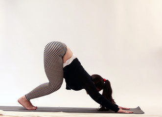 women practice yoga