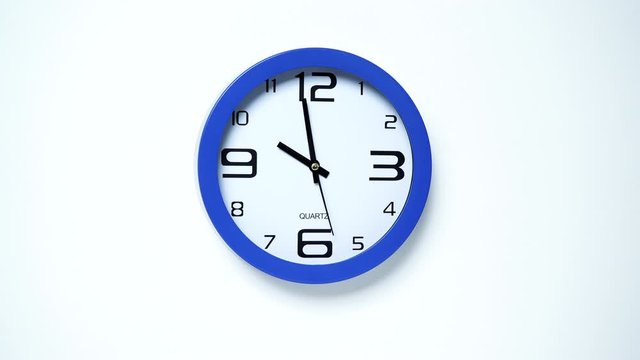 Blue wall clock ticking showing ten hours. 10 o'clock. Time deadline concept. Timelapse