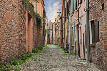 Ferrara, Emilia Romagna, Italy: old alley in the downtown of the ancient Italian city