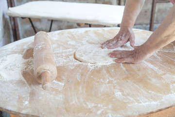 Woman preparing armenian bread lavash.