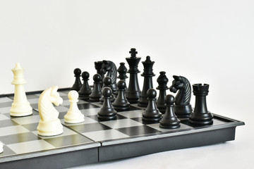 Chess. Chess king checkmate, the game of chess is over.
colorful chess pieces on a white background.