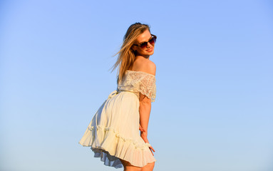 Obraz premium Impulsiveness and ease. Naturalness concept. Dancing woman. Mental health. Emotional girl. Happy girl white dress feel free. Summer party. Sunny day. Carefree girl. Freedom. Girl blue sky background
