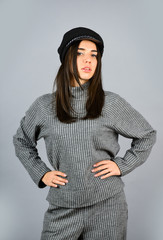 Fashionable knitwear. Warm comfortable clothes. Casual style for every day. Knitwear concept. Feel comfortable. Woman wear grey suit blouse and pants. Shop Your Style. Designed for your comfort