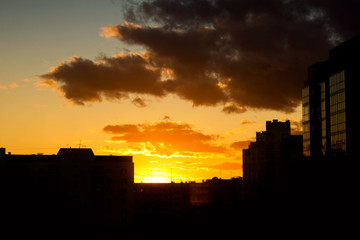 Fototapeta na wymiar Fiery sunset over the city
