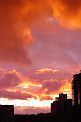 Fototapeta na wymiar Fiery sunset over the city
