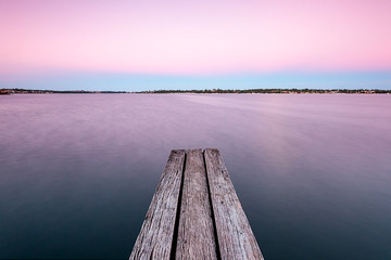 old wooden pier on the river