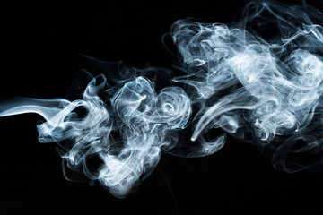 Photo of a wisp of smoke on a dark background