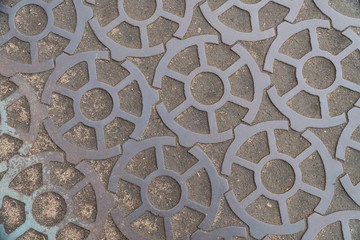 Background image of a road made of metal gears