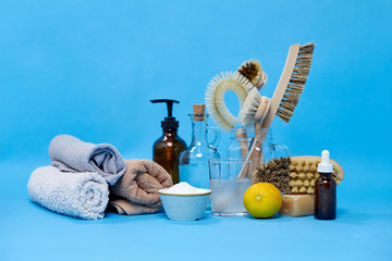 natural cleaning stuff, sustainability and eco living concept - lemon halves, washing soda, bottle...