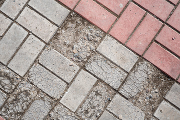 Background image of texture of pedestrian footpath covered by paving tiles